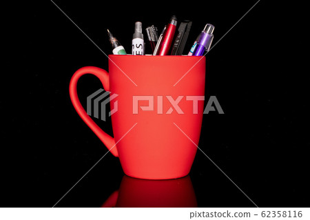 Ballpoint writing pen isolated on black glass Ballpoint writing pen isolated on black glass 62358116