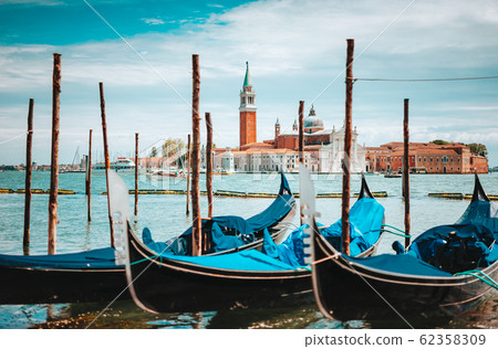 Venice, Italy. Close up of Gondolas and San Giorgio Maggiore church on Grand Canal in background Venice, Italy. Close up of Gondolas and San Giorgio Maggiore church on Grand Canal in background 62358309