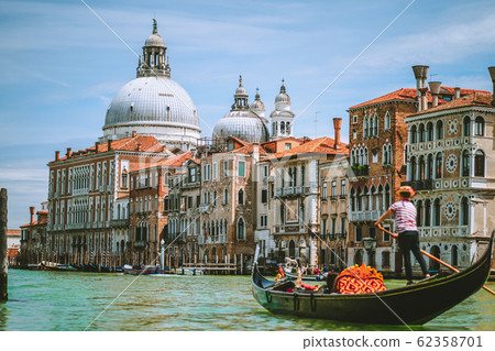 Grand Canal, Traditional Gondola and Basilica Santa Maria della Salute in background, Venice, Italy Grand Canal, Traditional Gondola and Basilica Santa Maria della Salute in background, Venice, Italy 62358701
