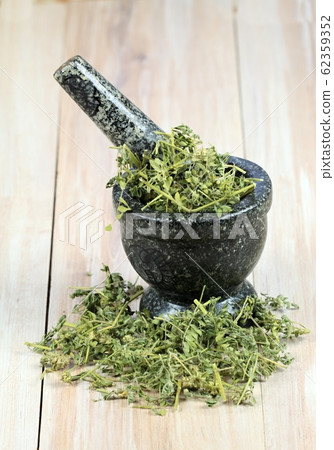 Dried Tribulus terrestris in the mortar 62359352