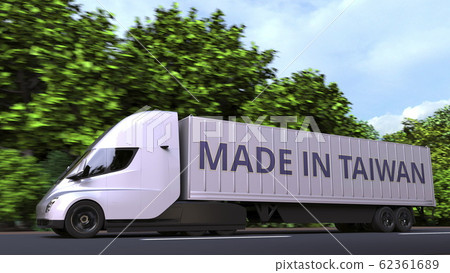 Modern electric semi-trailer truck with MADE IN TAIWAN text on the side. Taiwanese import or export related 3D rendering 62361689