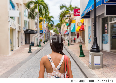 Woman tourist walking in shopping streets of Philipsburg, St Maarten, popular port of call for cruise ship travel destination. Caribbean tropical getaway. 62363173