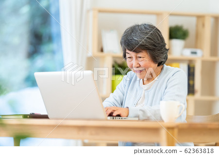 Grandma using a computer Portrait of senior woman Silver generation Elderly woman Grandma using a computer Portrait of senior woman Silver generation Elderly woman 62363818