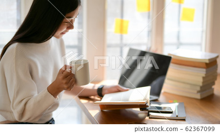 Portrait of college student studying for her 62367099