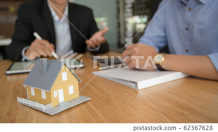 Close up view of real estate agent using  blank 62367628