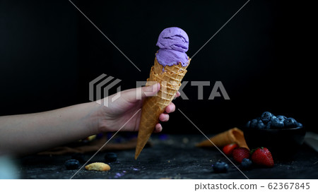 Close up view of a girl holding blueberry 62367845