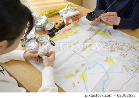 Family (light) checking emergency supplies Family (light) checking emergency supplies 62368655