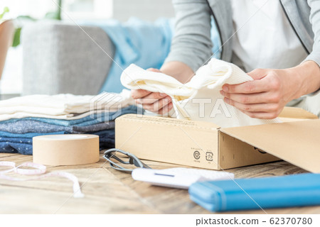 Hand of a young man trying to put out clothes that do not need Mercari 62370780