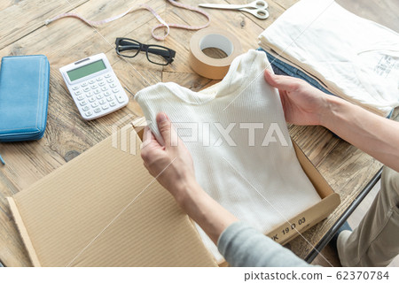 Hand of a young man trying to put out clothes that do not need Mercari Hand of a young man trying to put out clothes that do not need Mercari 62370784