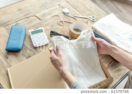 Hand of a young man trying to put out clothes that do not need Mercari 62370786
