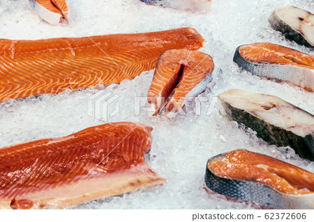 fillets and steaks of fish salmon and cod lie on the ice fillets and steaks of fish salmon and cod lie on the ice 62372606