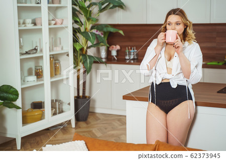 Dreamy young female enjoying her aroma tea 62373945