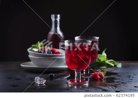 Glasses of a red berry juice 62374195