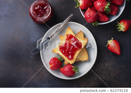 Toasts with strawberry jam Toasts with strawberry jam 62374238