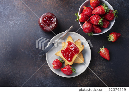 Toasts with strawberry jam 62374239
