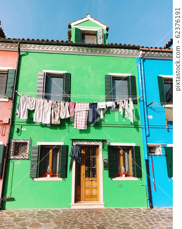 BURANO, ITALY - JANUARY 20, 2020: Colorful houses on the island of Burano in Italy. Burano island is famous for its colorful fisherman's houses. 62376191