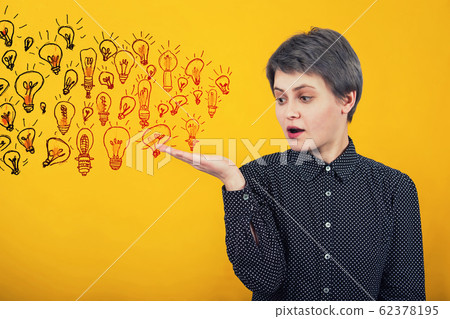 Businesswoman keeps hand raised like receiving a 62378195