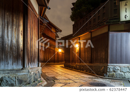 Stone wall alley at night Kyoto 62378447