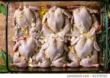 Raw uncooked quails Raw uncooked quails 62378502