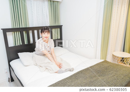 Young woman relaxing Young woman relaxing 62380305