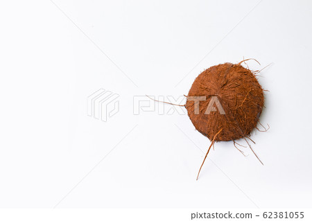 Summer composition of half coconut on a grey Summer composition of half coconut on a grey 62381055