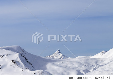 High mountains with snowy peak and sunlit cloudy 62381461