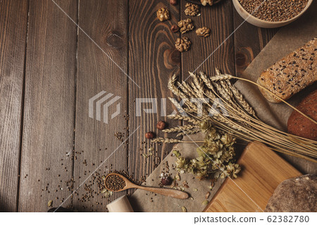 Whole grain multigrain bread, whole and sliced, contains seeds isolated on black Whole grain multigrain bread, whole and sliced, contains seeds isolated on black 62382780