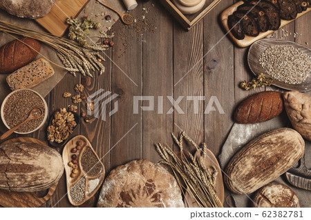 Whole grain multigrain bread, whole and sliced, contains seeds isolated on black Whole grain multigrain bread, whole and sliced, contains seeds isolated on black 62382781