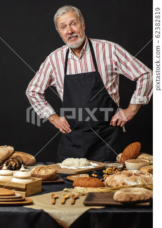 Male senior chef isolated on black background 62382819