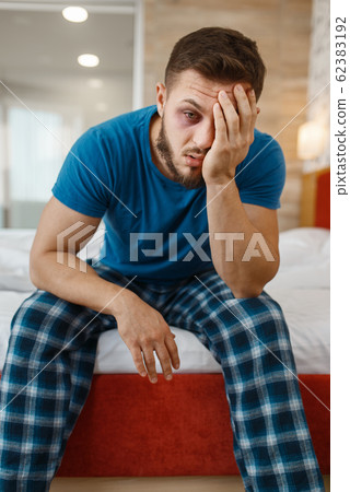 Tired man awake in bed 62383192