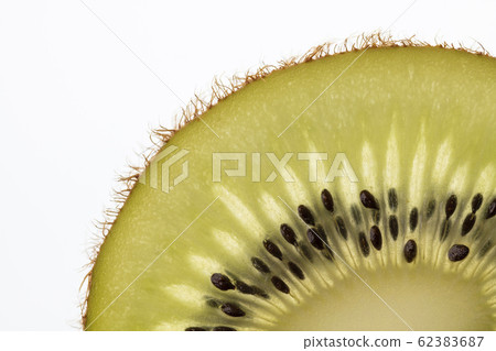 Part of a cut kiwi fruit in backlight foto shot. 62383687