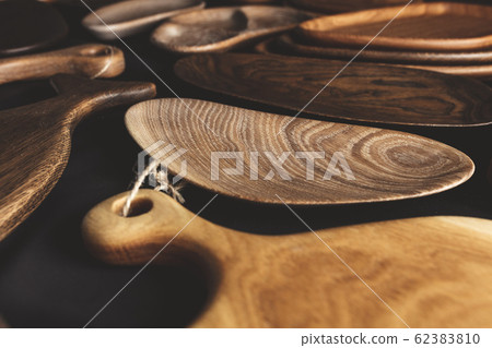 Set of cutting boards on wooden background Set of cutting boards on wooden background 62383810