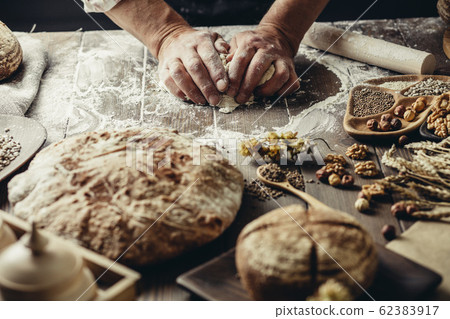 Whole grain multigrain bread, whole and sliced, contains seeds isolated on black Whole grain multigrain bread, whole and sliced, contains seeds isolated on black 62383917