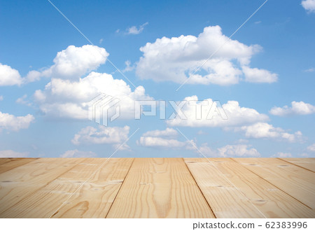Blue sky background with wooden planks Blue sky background with wooden planks 62383996