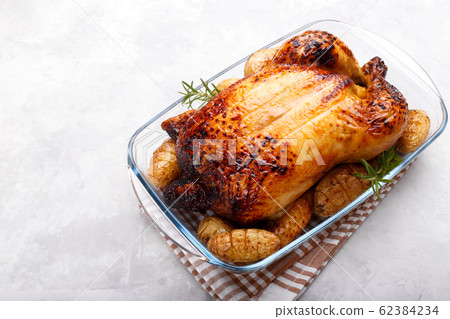 Roasted chicken and potatoes Roasted chicken and potatoes 62384234
