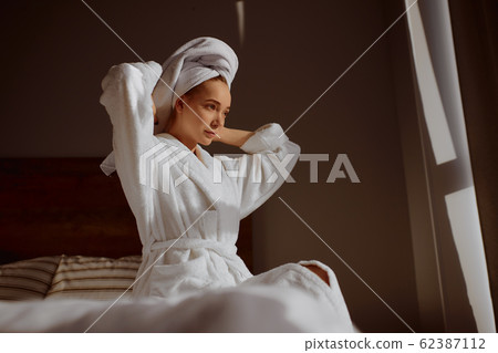 Attractive Young Woman Wrapped with Bath Towel 62387112