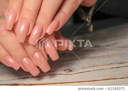 Amazing natural nails. Women's hands with clean 62388371