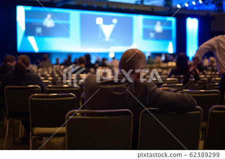 Audience listening to presentation Audience listening to presentation 62389299