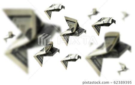 Hundred dollar bills in the shape of birds in flight on a white background 62389395