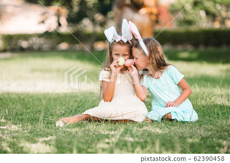 Portrait of kid with easter busket with eggs outdoor 62390458