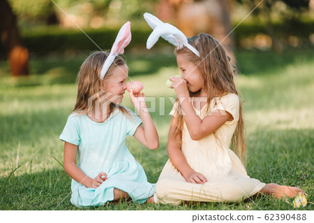 Portrait of kid with easter busket with eggs outdoor Portrait of kid with easter busket with eggs outdoor 62390488