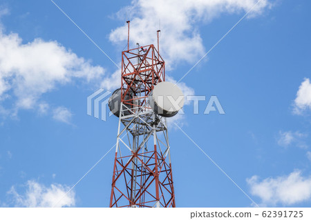 Red and white tower of communications with a lot Red and white tower of communications with a lot 62391725