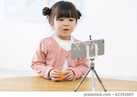 Image of a girl shooting a movie with a smartphone Children YouTuber 62392605
