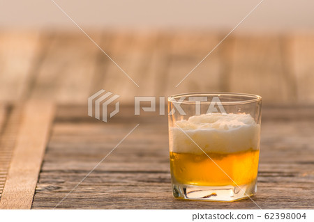 Beer in a glass with evening light.3 Beer in a glass with evening light.3 62398004