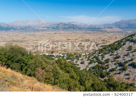 View on the towns of Plati and Magoulas on the Lasithi Plateau, Crete, Greece View on the towns of Plati and Magoulas on the Lasithi Plateau, Crete, Greece 62400317