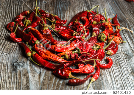 mexican food. dried red hot chilli pepper on wooden background. spicy taste mexican food. dried red hot chilli pepper on wooden background. spicy taste 62401420