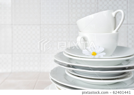 Clean dishes on the kitchen table 62401441