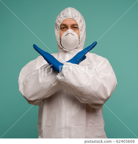 A male doctor in protective overalls and a mask A male doctor in protective overalls and a mask 62403608