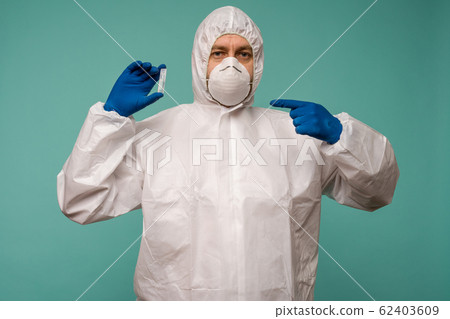 A male doctor in protective overalls and a mask 62403609