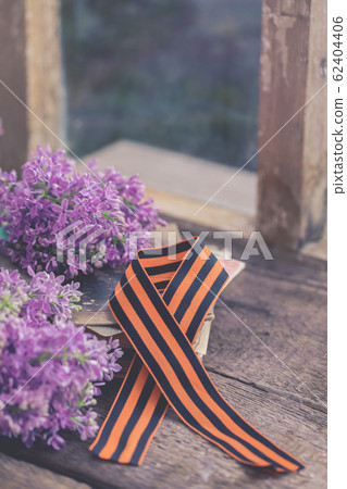Traditional Saint George ribbon on old books 62404406
